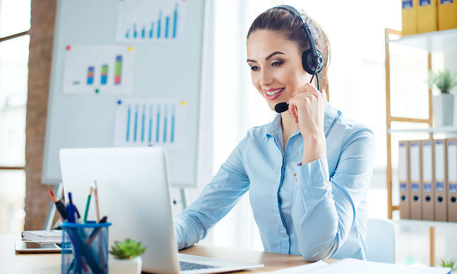 Image of a young woman talking into a headset